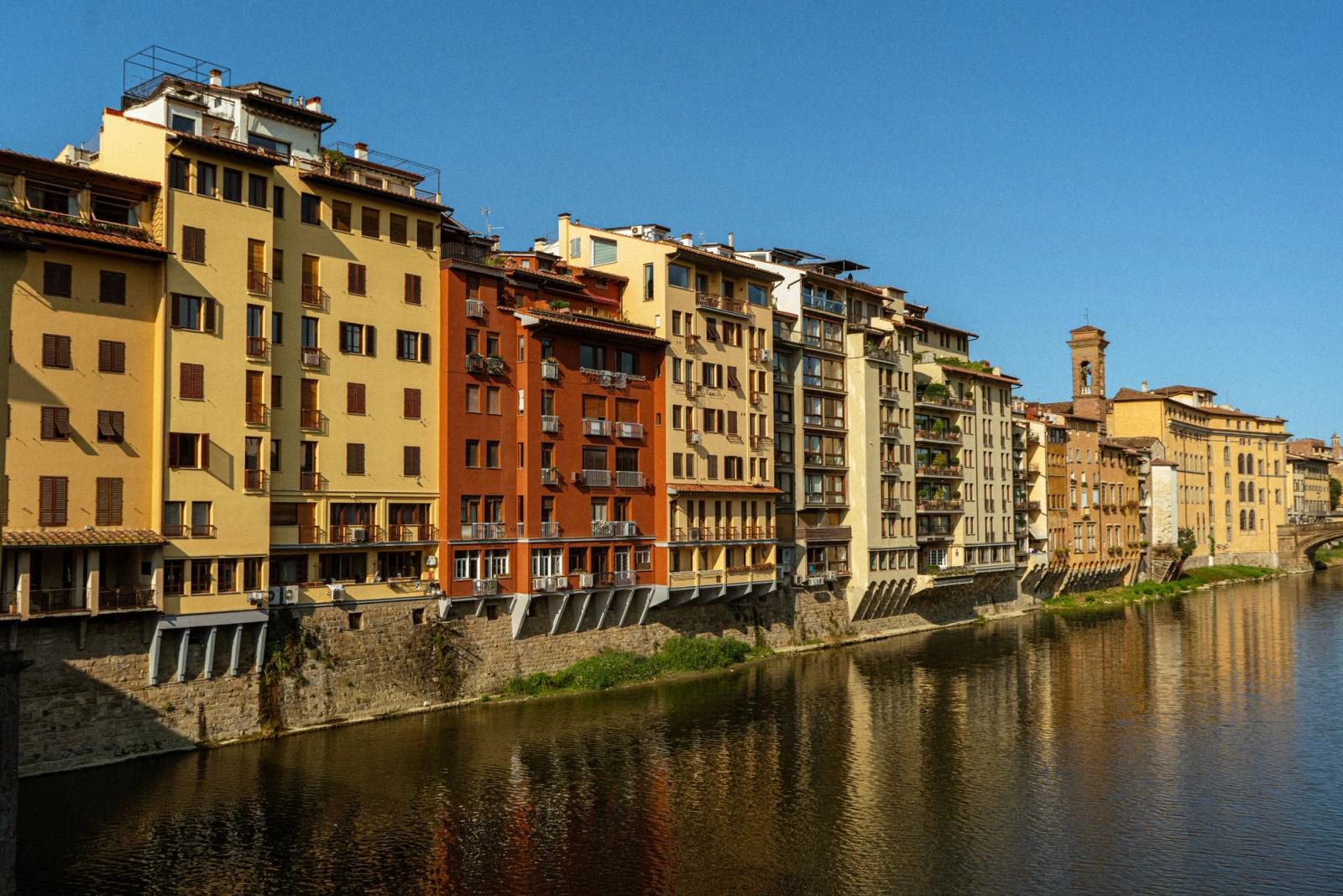 Charming view of riverside buildings in Florence, Italy, captivating architecture along the Arno River
