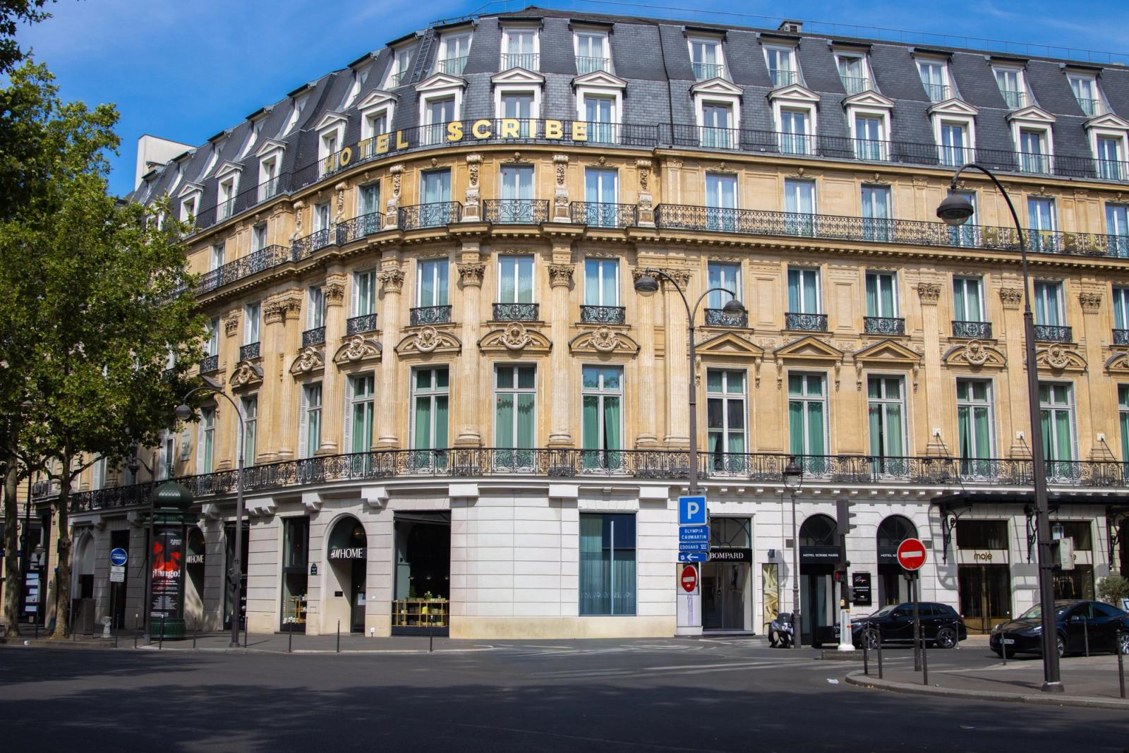 Elegant facade of Hotel Scribe in Paris captured in daylight showcasing classic French architecture