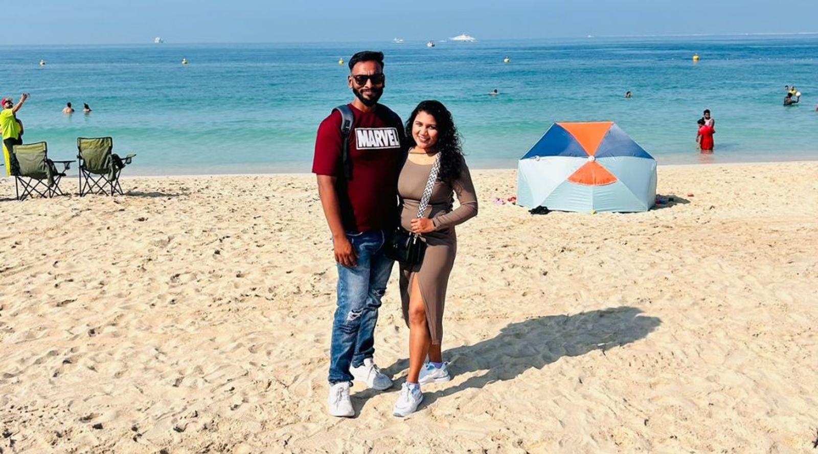 Couple clicking photo on a beach 
