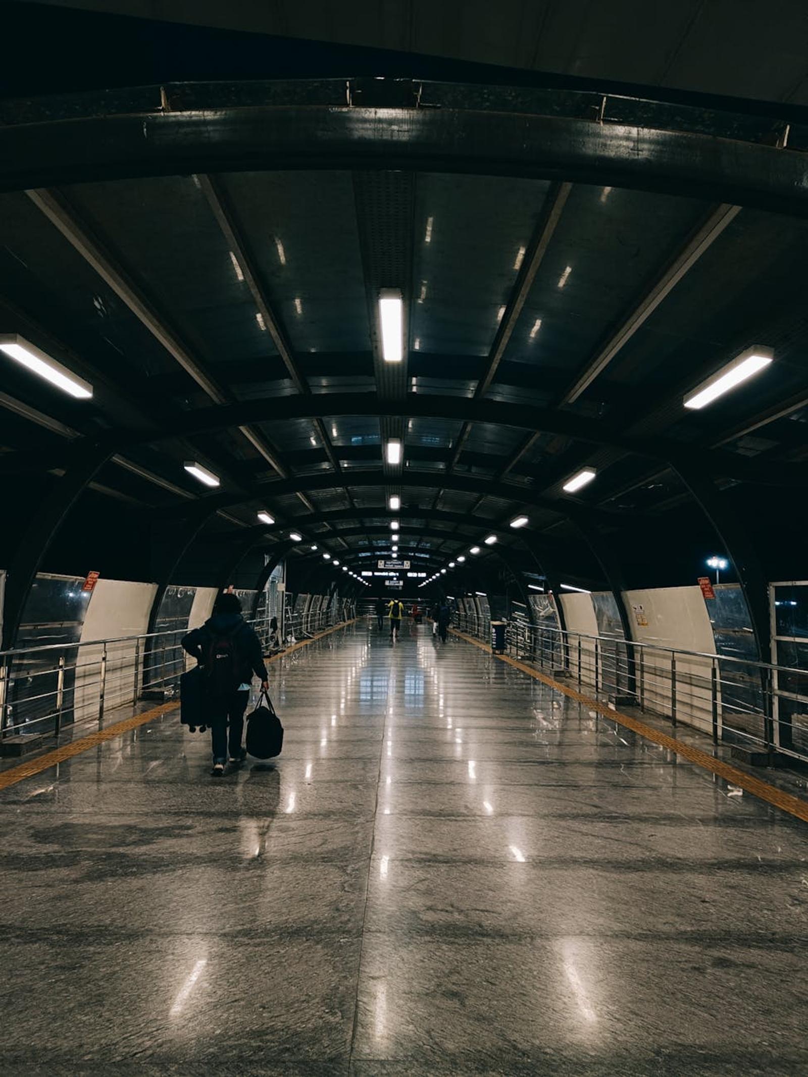 A sleek, urban corridor in Bengaluru Airport at night