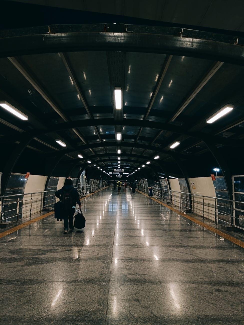 A sleek, urban corridor in Bengaluru Airport at night