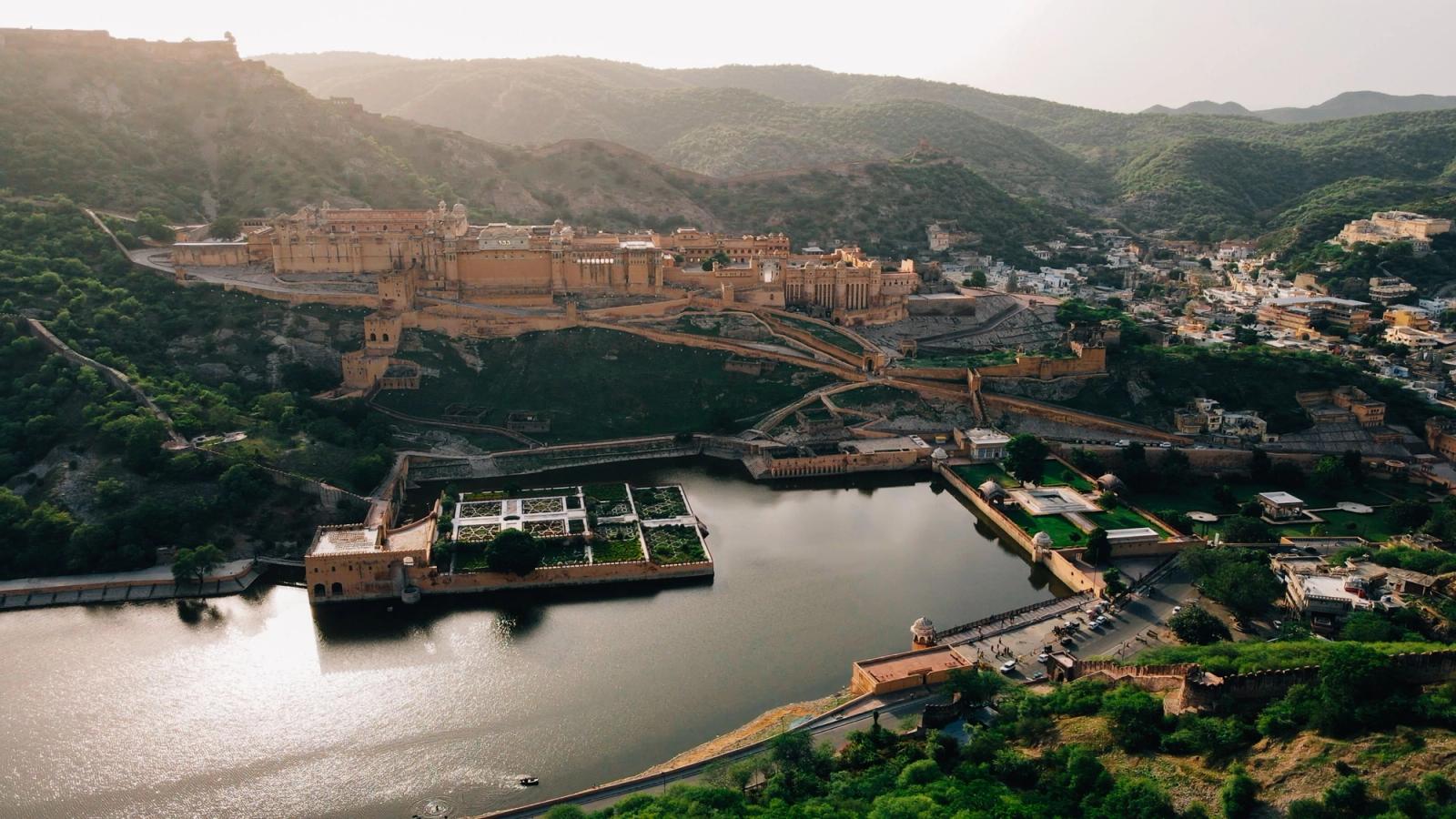 A breathtaking aerial view of Amber Fort, Jaipur with Maota Lake and scenic surroundings
