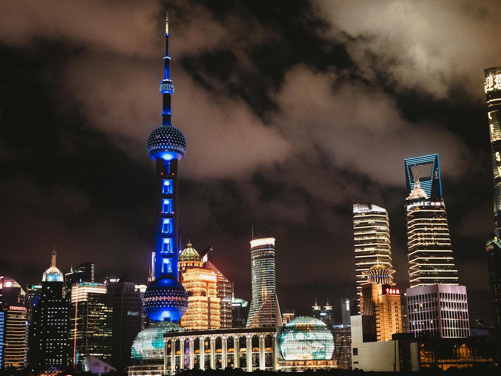 Captivating night view of Shanghai's illuminated skyline featuring the iconic Oriental Pearl Tower