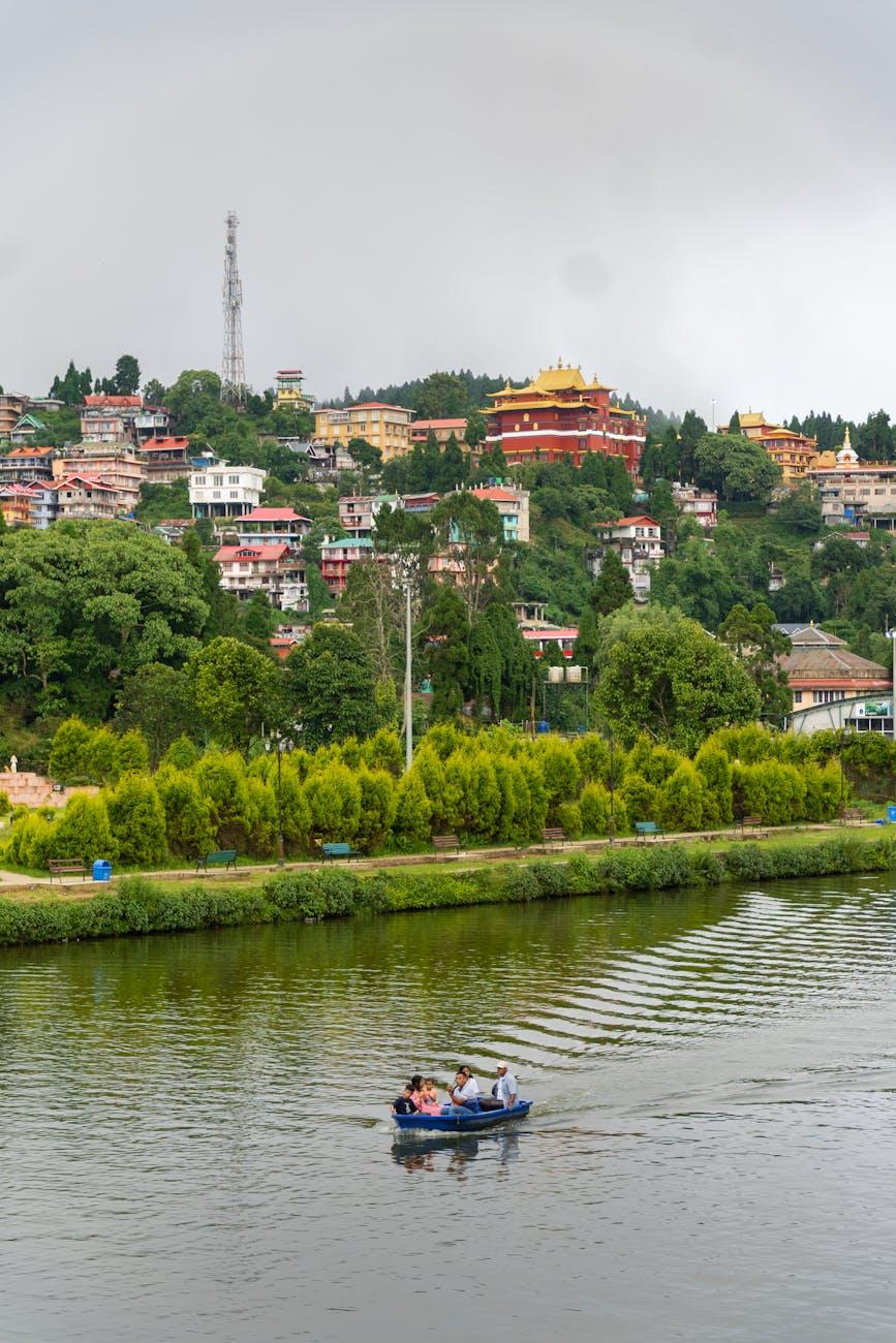 Explore the tranquil beauty of Mirik Lake with scenic hills and traditional architecture