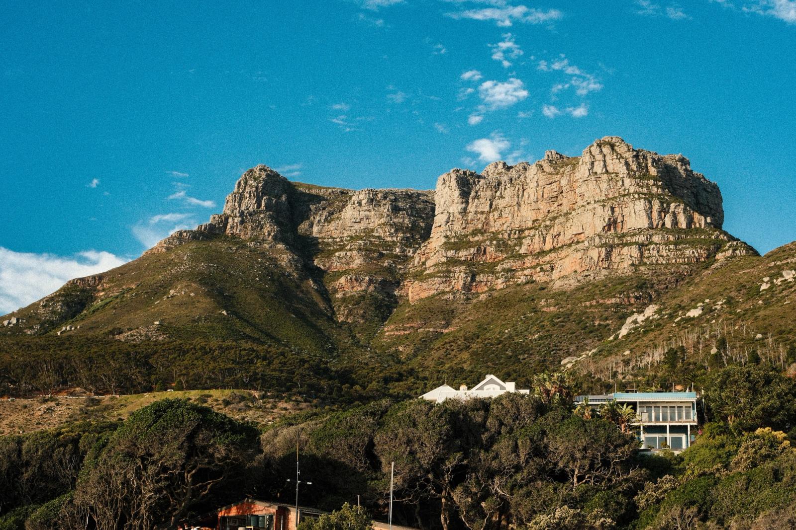 Scenic view of the Twelve Apostles mountain range under a clear blue sky in Cape Town, South Africa