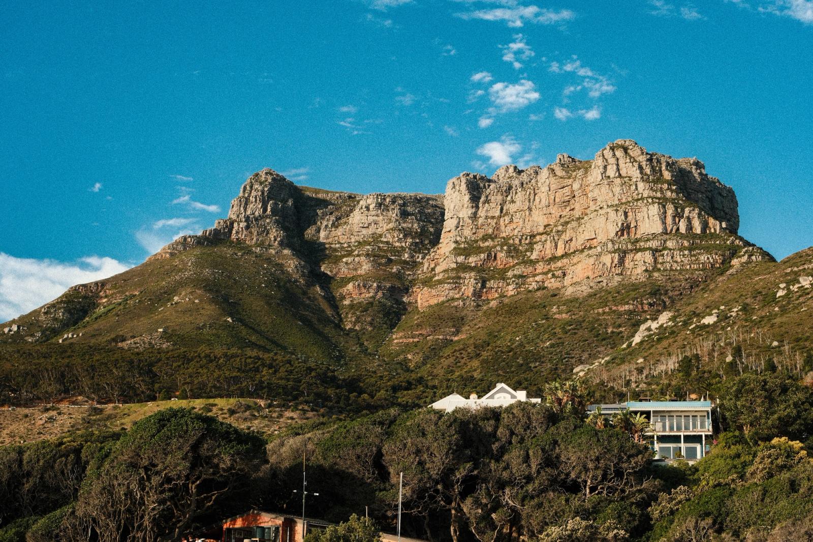Scenic view of the Twelve Apostles mountain range under a clear blue sky in Cape Town, South Africa