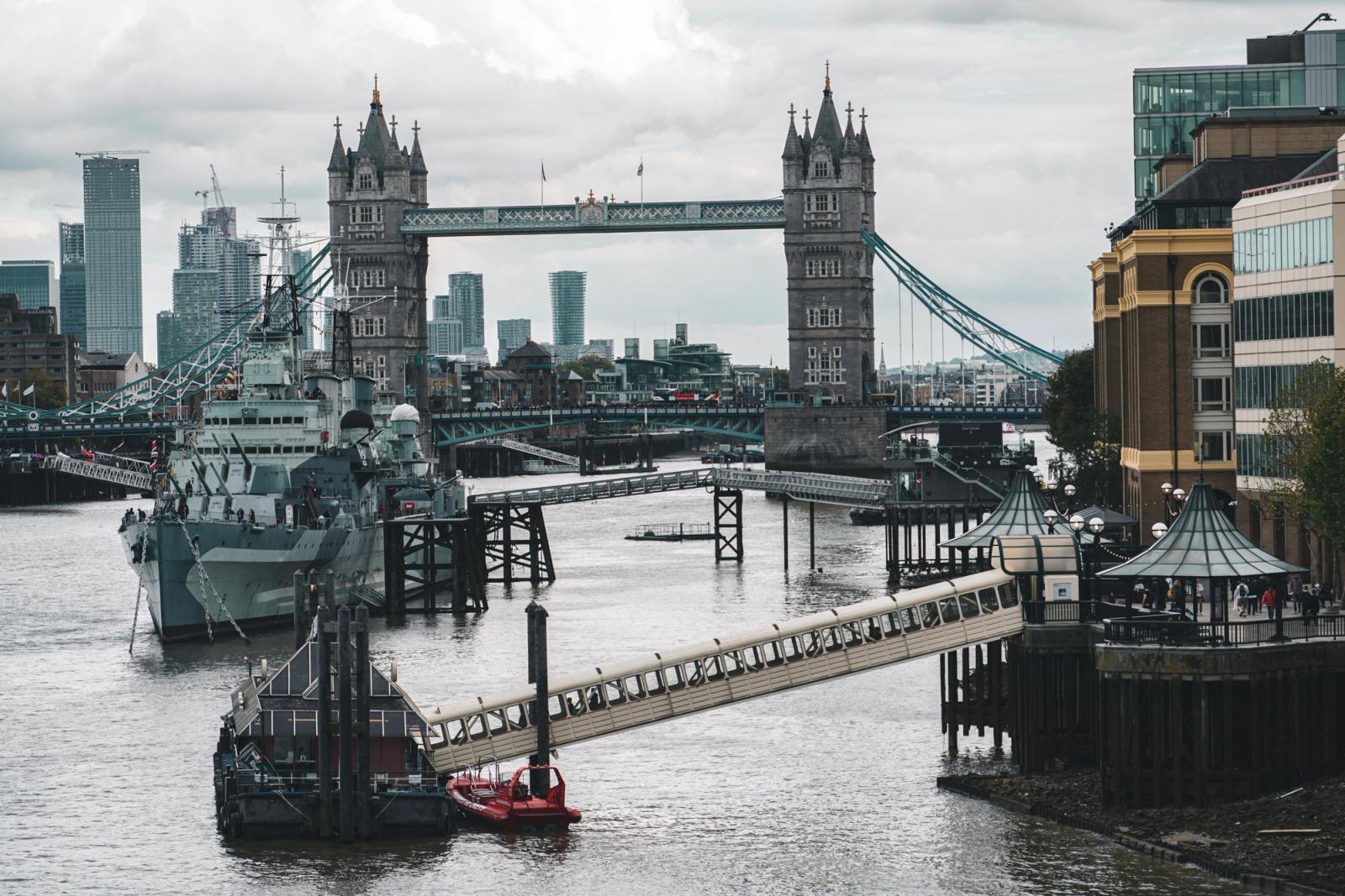 Stunning view of Tower Bridge and River Thames with cityscape and watercrafts in London, UK