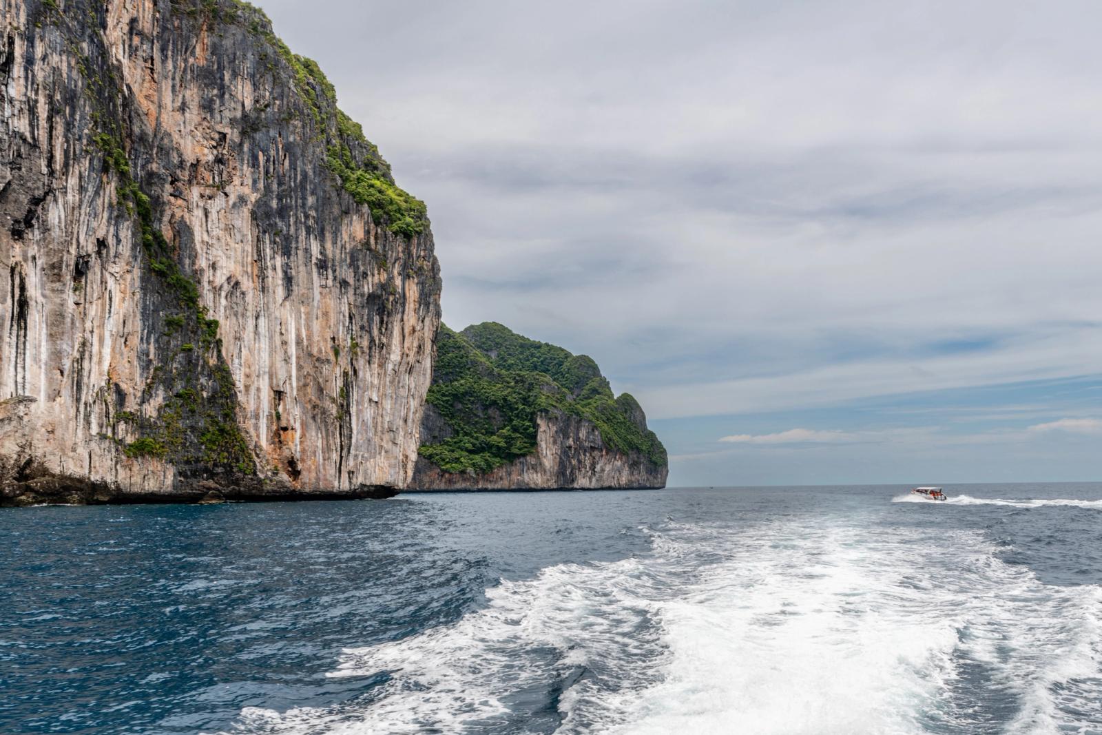 Discover the stunning cliffs and blue seas of Phuket, Thailand with this scenic view