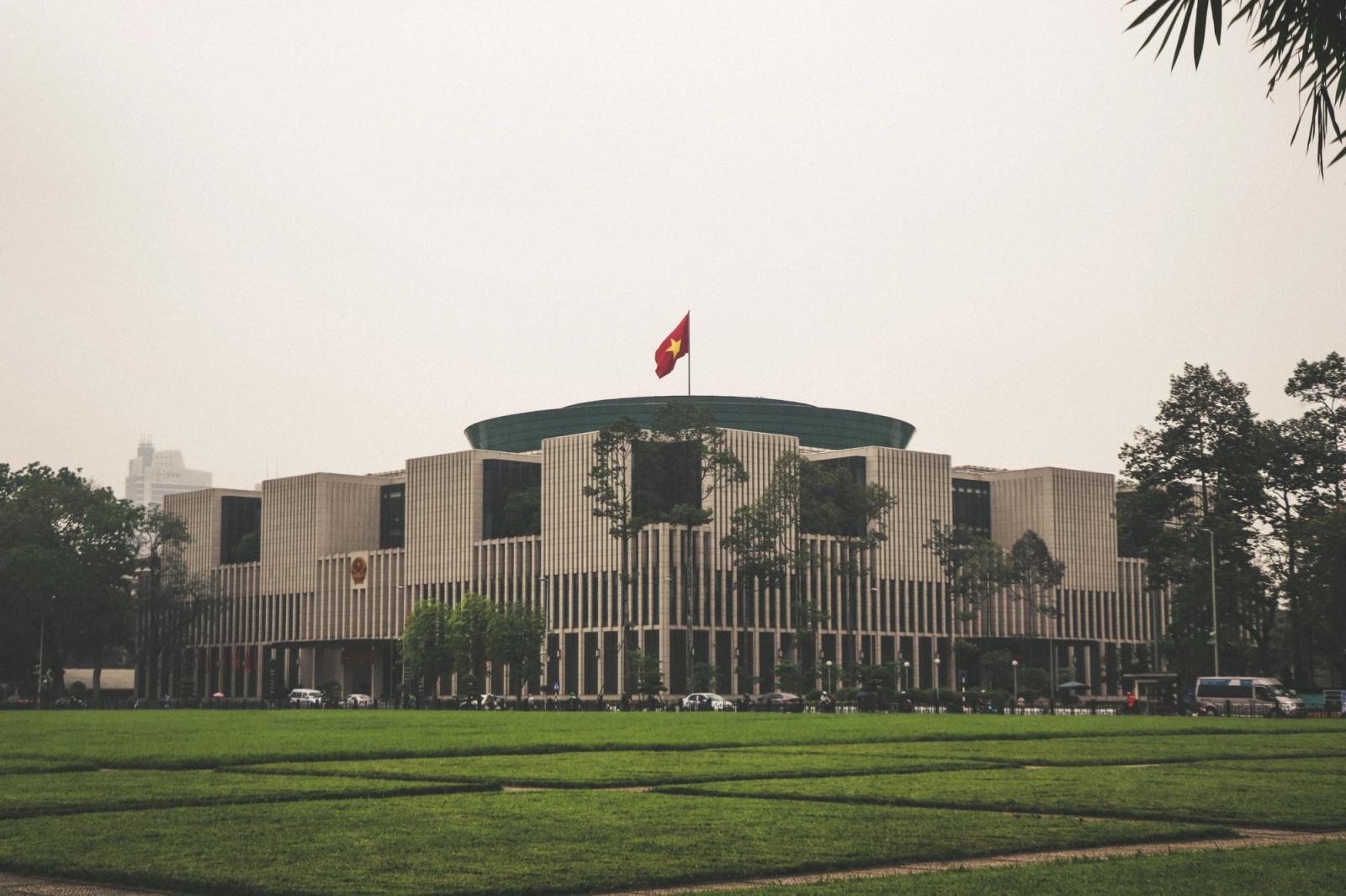 View of the Vietnam National Assembly Building in Hanoi with Vietnamese flag