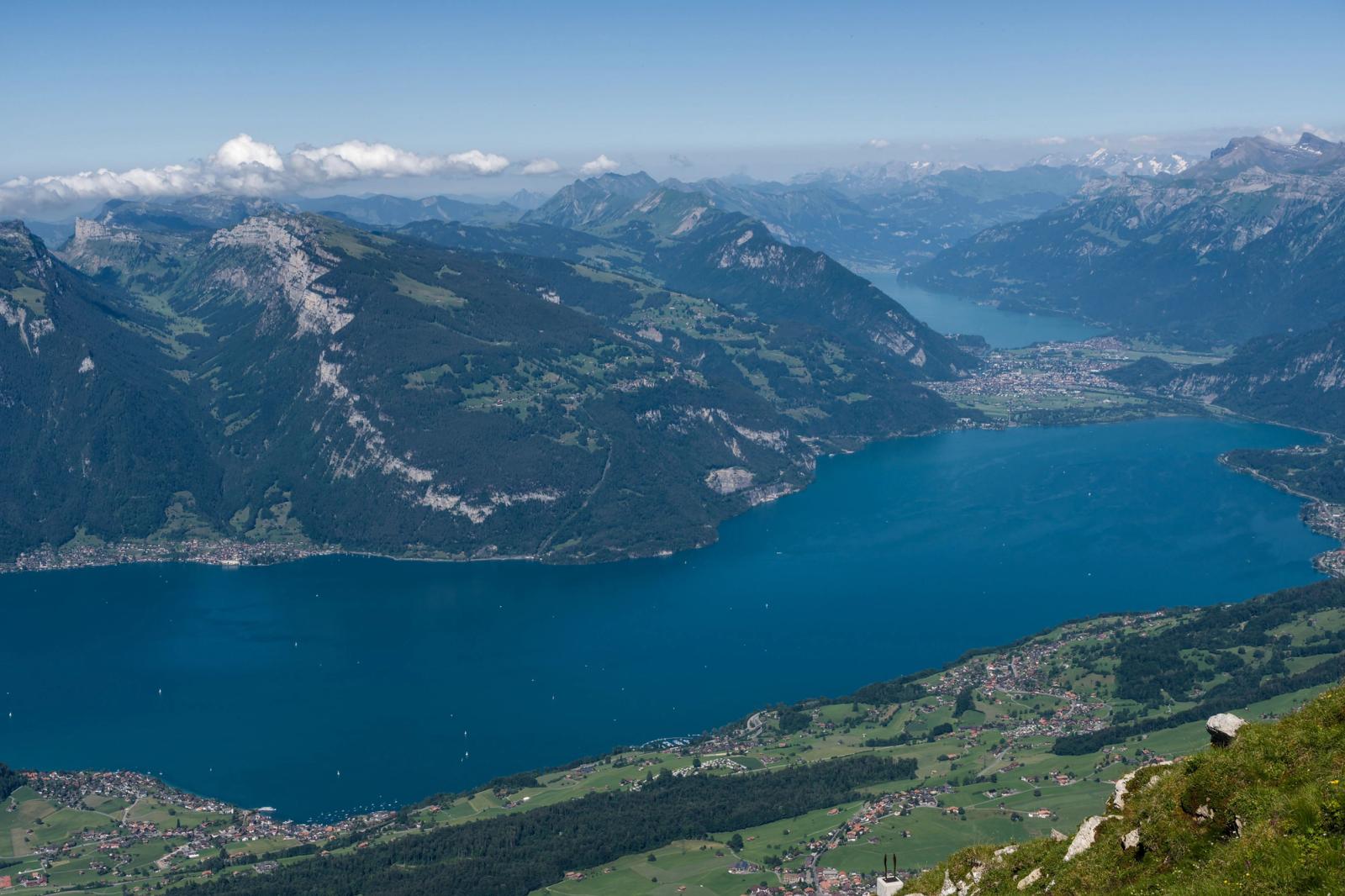 Breathtaking aerial view of Lake Lucerne amidst the majestic Swiss Alps on a clear summer day