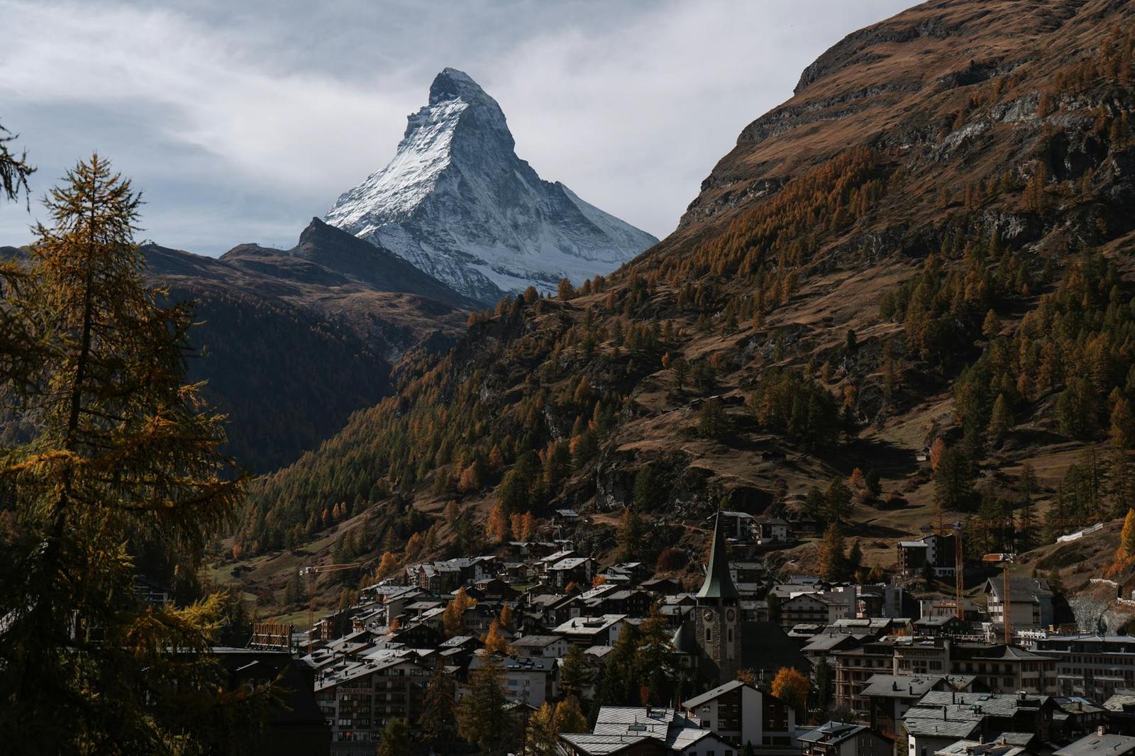Stunning view of the Matterhorn towering over Zermatt, Switzerland, surrounded by autumn foliage