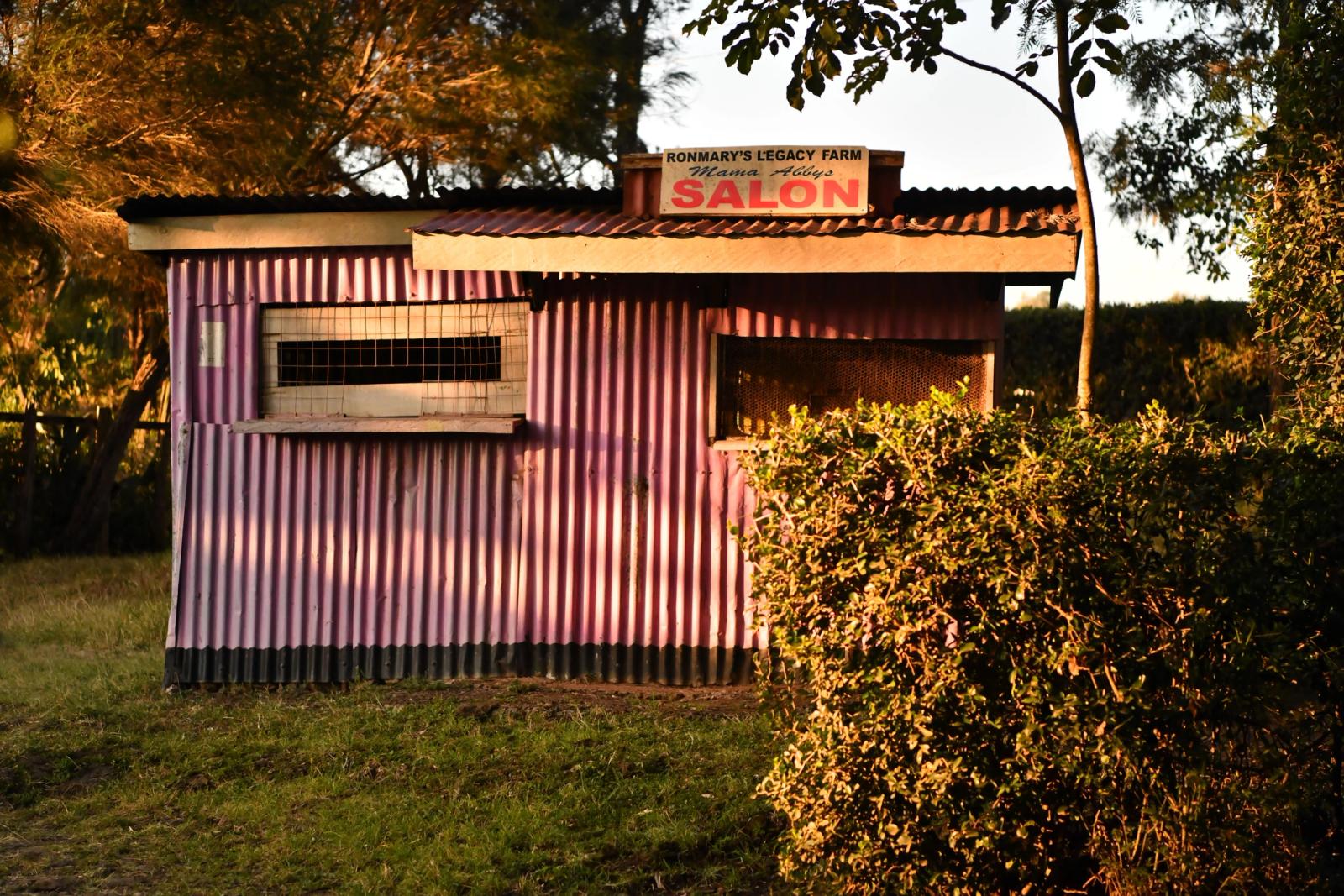 Colorful rustic salon at sunset in Nairobi, Kenya, showcasing local architecture and vibrant hues