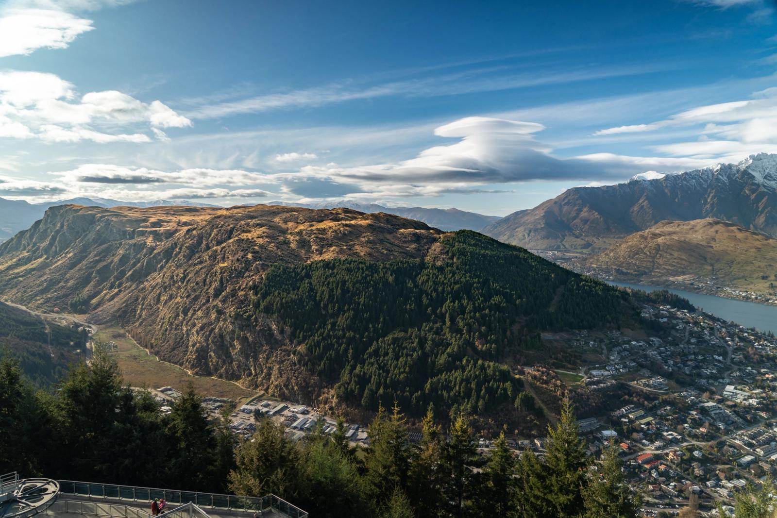 Breathtaking aerial view of Queenstown, New Zealand showcasing lush mountains and vibrant townscape