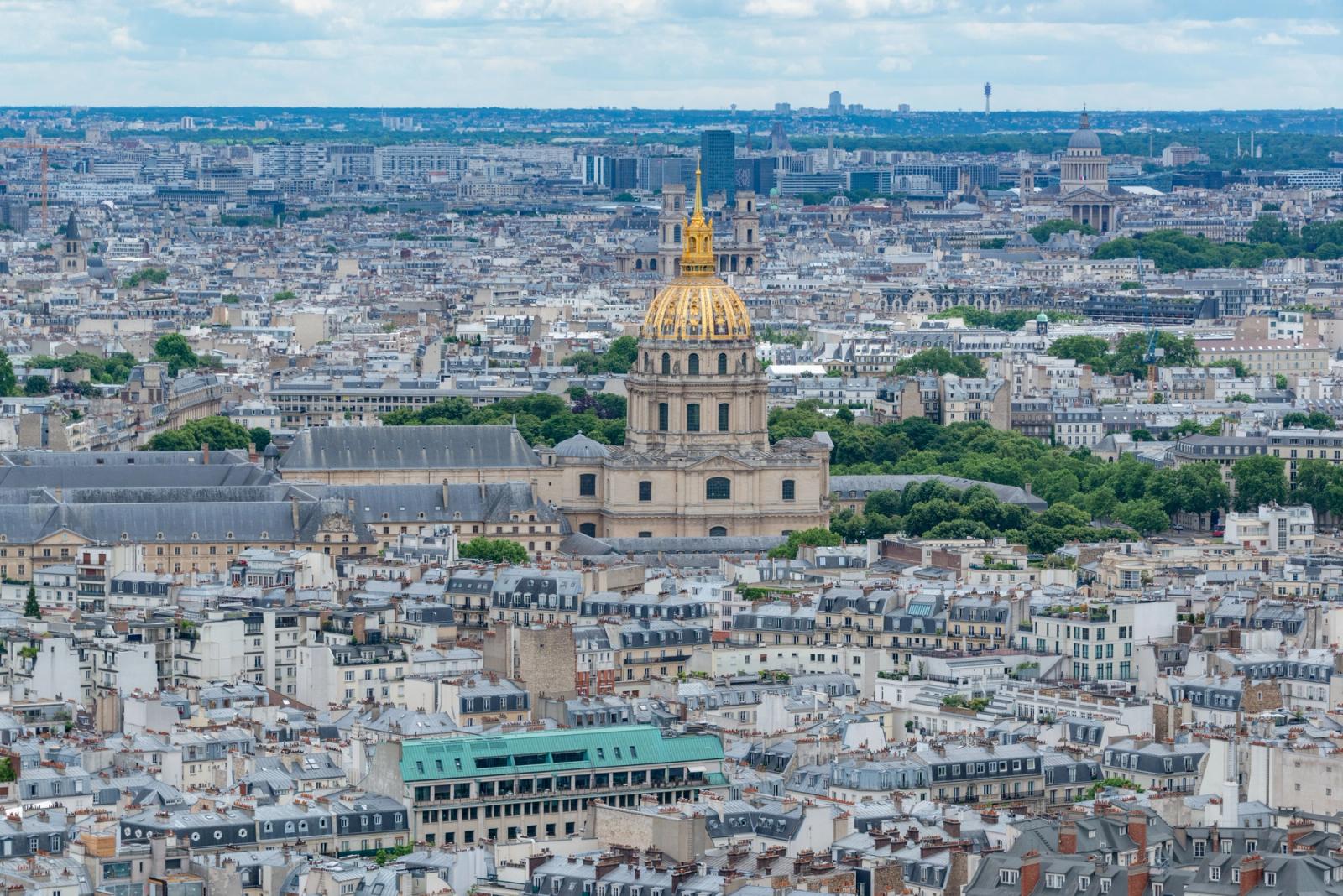 Stunning aerial view of the Parisian skyline featuring the iconic Les Invalides dome