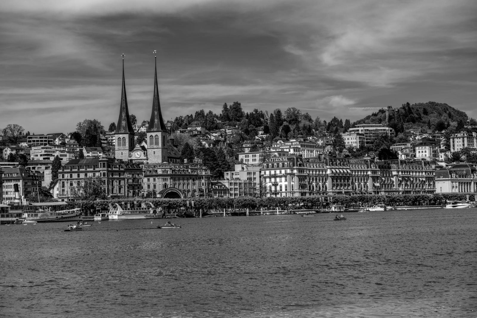 Stunning black and white photo capturing the iconic Lucerne cityscape with its distinctive architecture and towers
