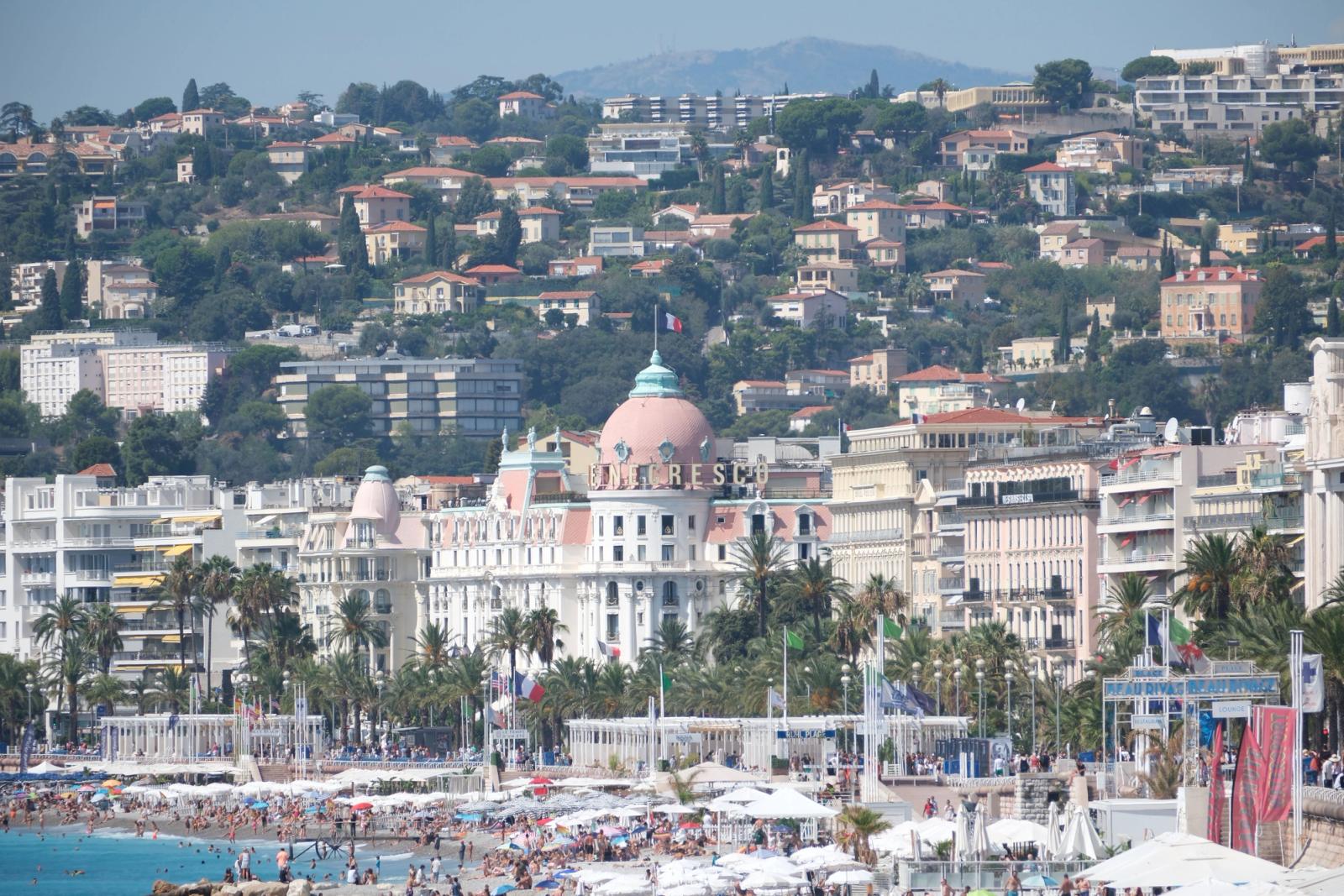 View of the famed beaches and luxurious hotel in Nice, France, during a vibrant summer day