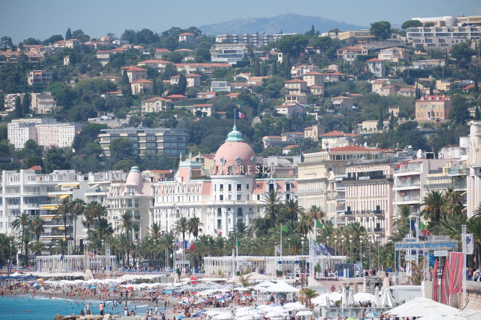 View of the famed beaches and luxurious hotel in Nice, France, during a vibrant summer day