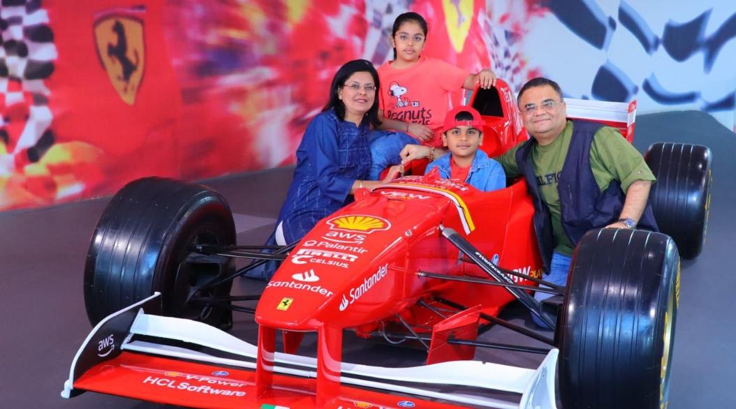 A family photo with f1 car