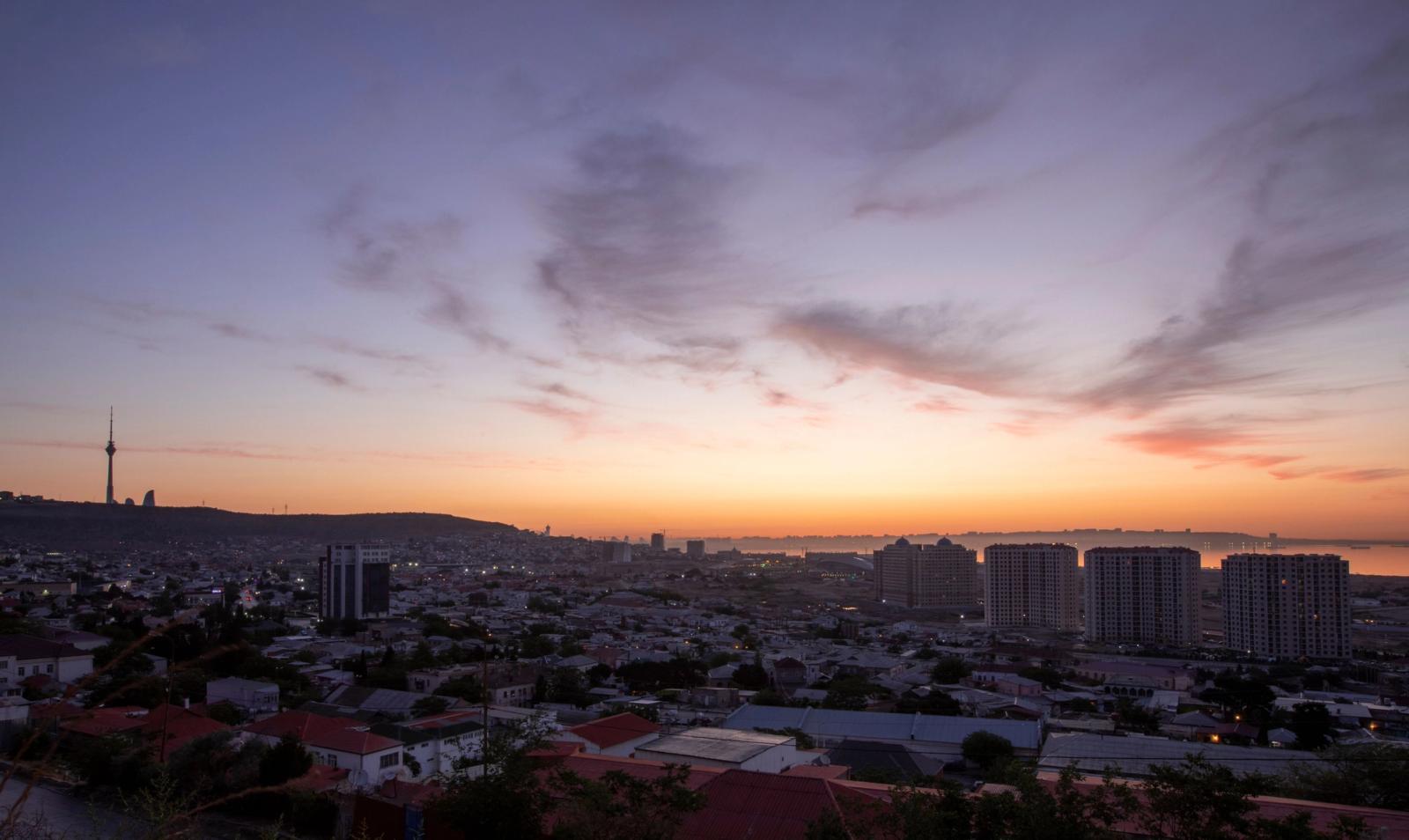 Stunning aerial view of Baku, Azerbaijan cityscape during sunset with the Caspian Sea