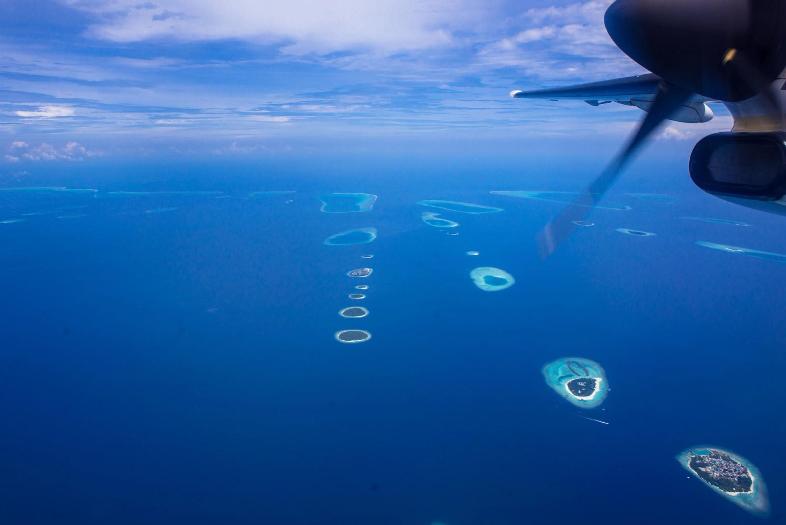 Stunning aerial seaplane view of Maldives atolls over the ocean