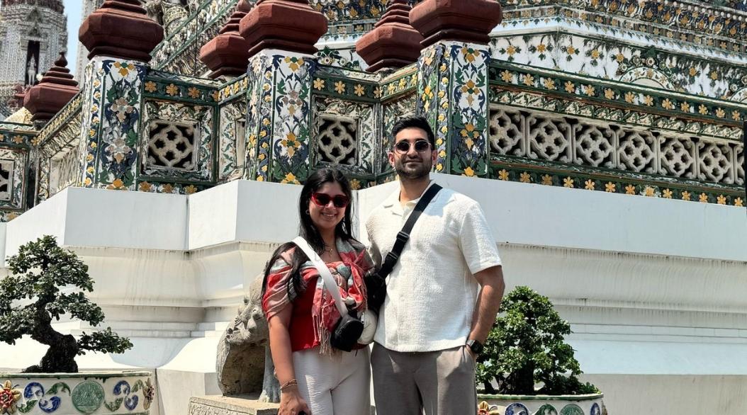 Couple posing in front of temple
