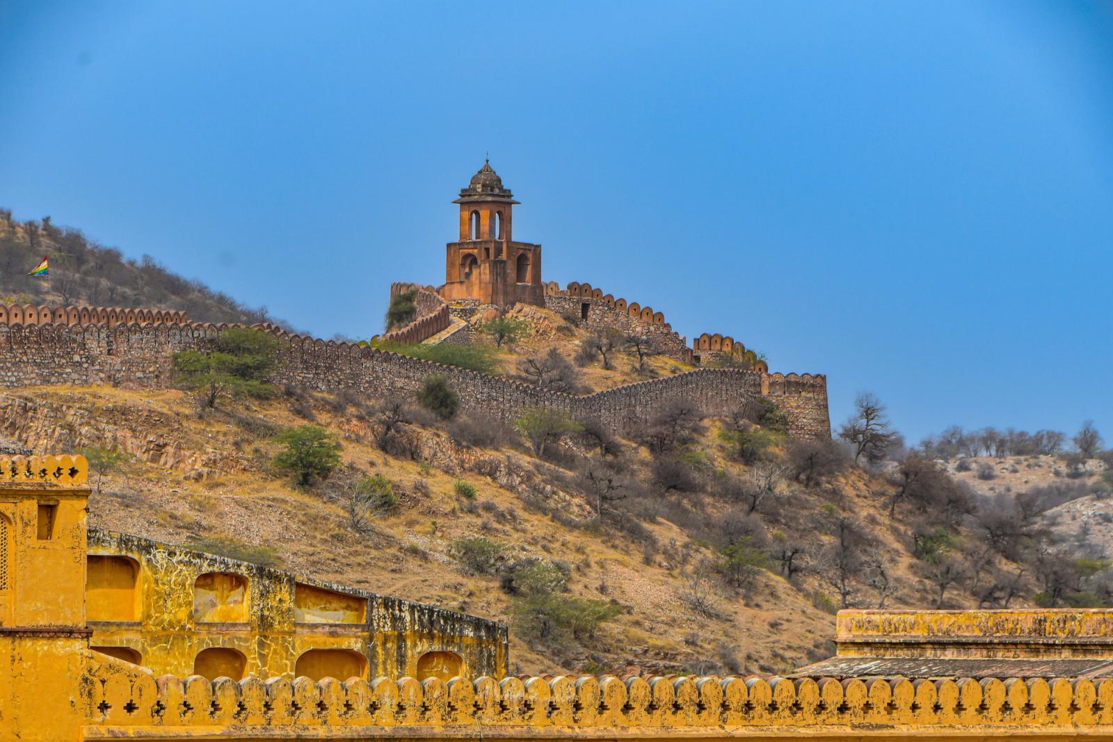 Discover the historic Amber Fort amidst the rugged hills of Jaipur, India, a stunning travel destination