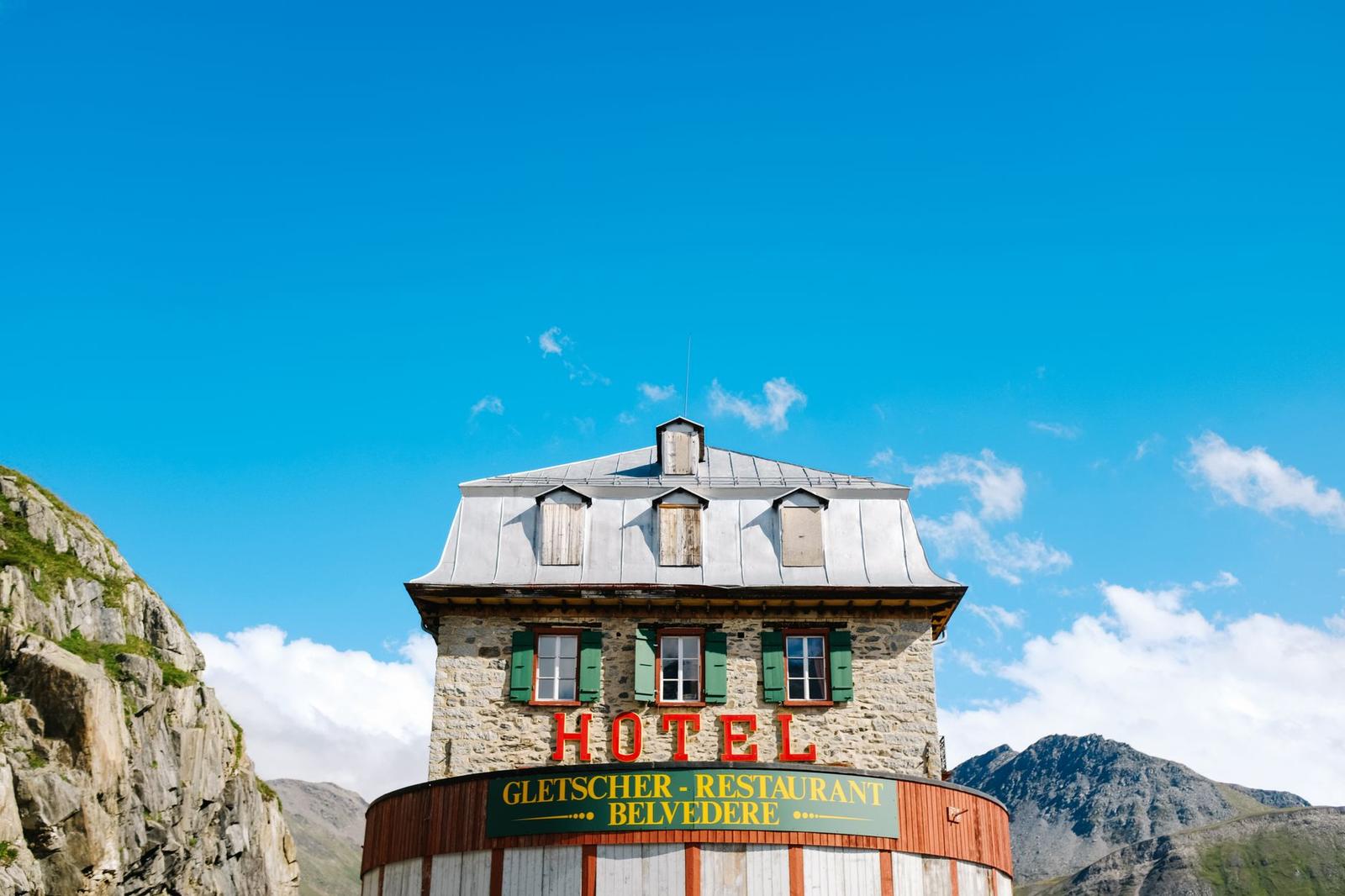 Stunning facade of the Belvedere Hotel in the Swiss Alps under a clear blue sky