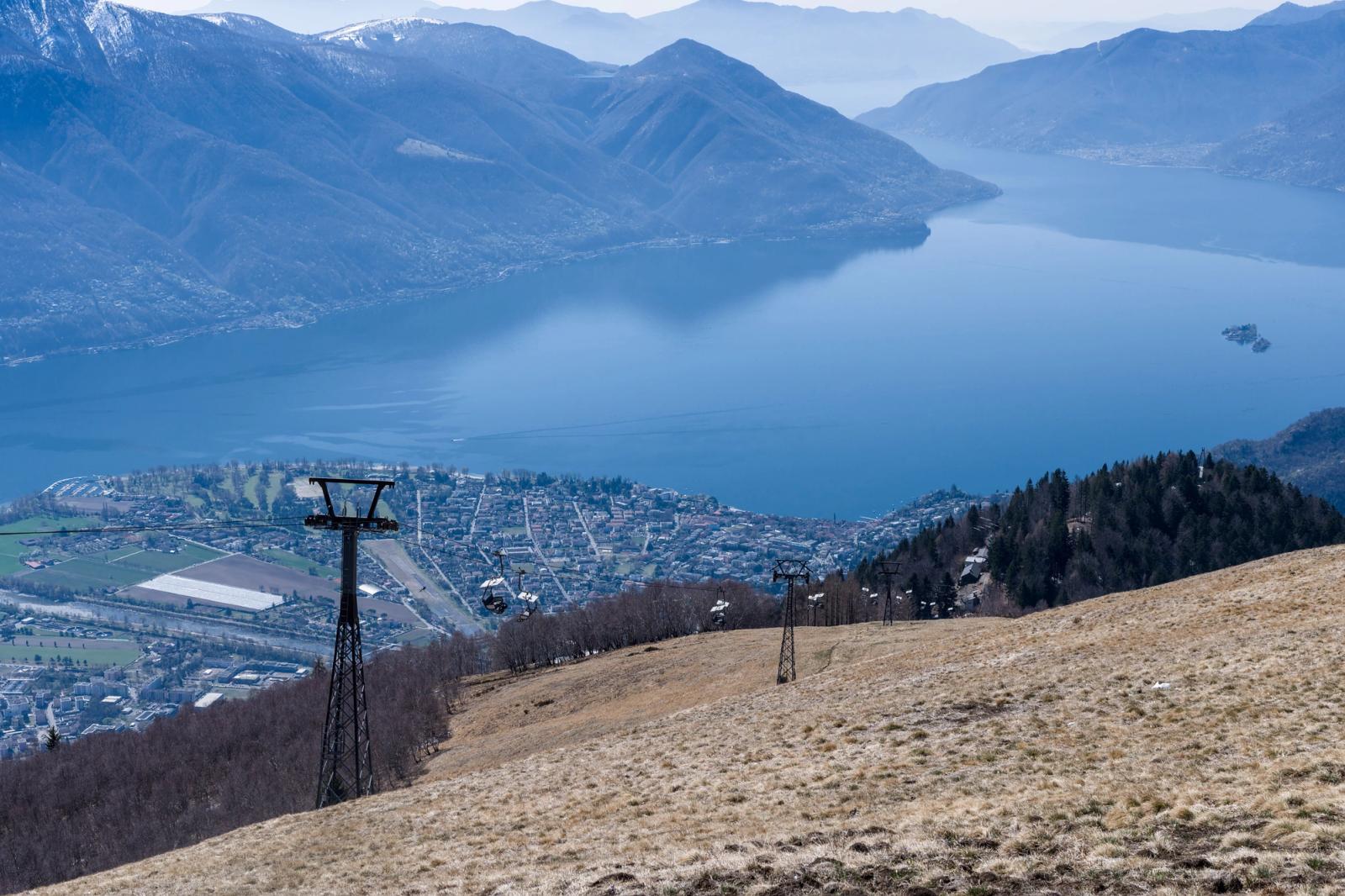 Breathtaking aerial view of Lake Maggiore and surrounding mountains from an alpine vantage point in Switzerland