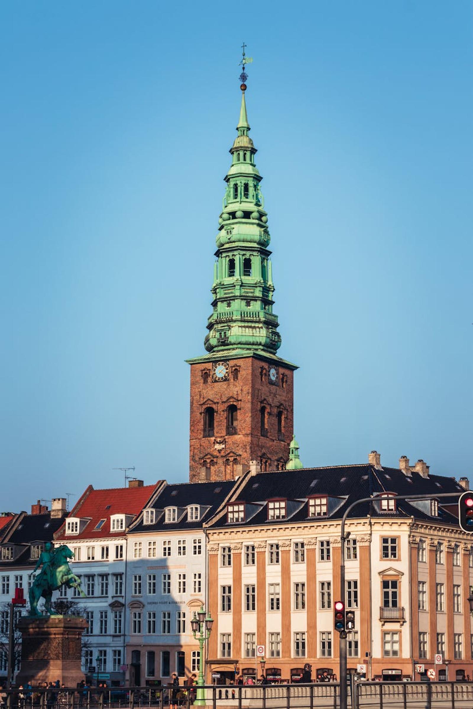 Scenic view of a historic tower and traditional buildings in Copenhagen, Denmark