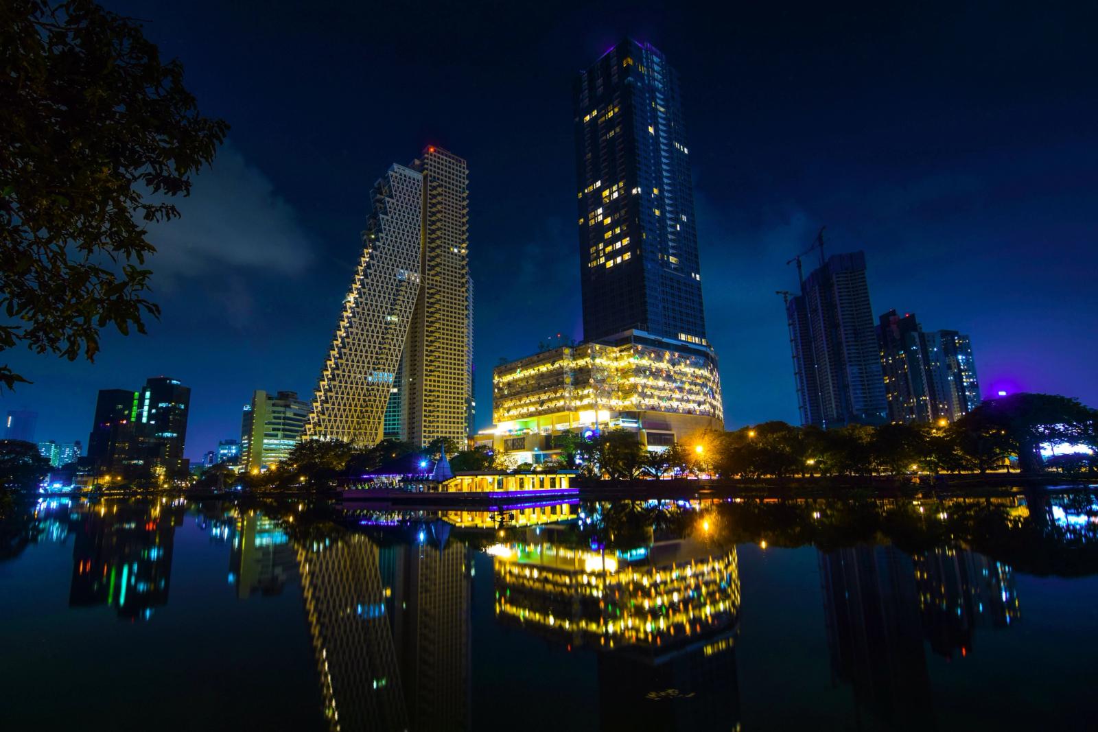 Stunning night view of Colombo's modern skyline reflected in calm waters