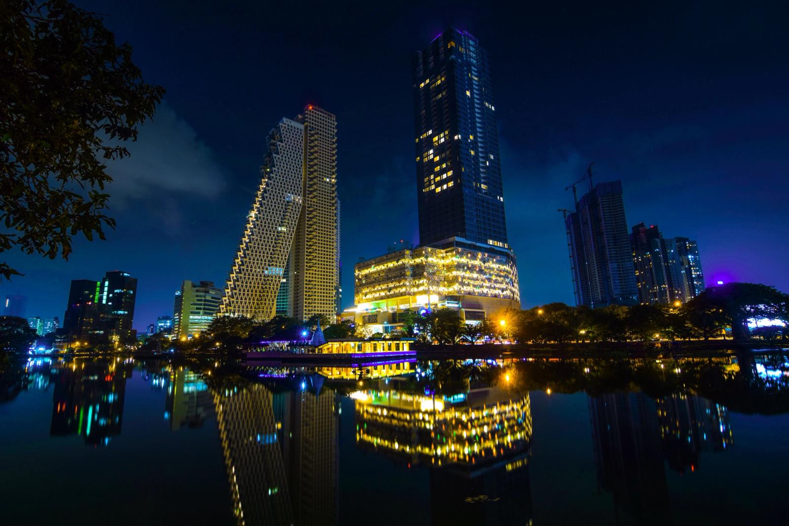 Stunning night view of Colombo's modern skyline reflected in calm waters