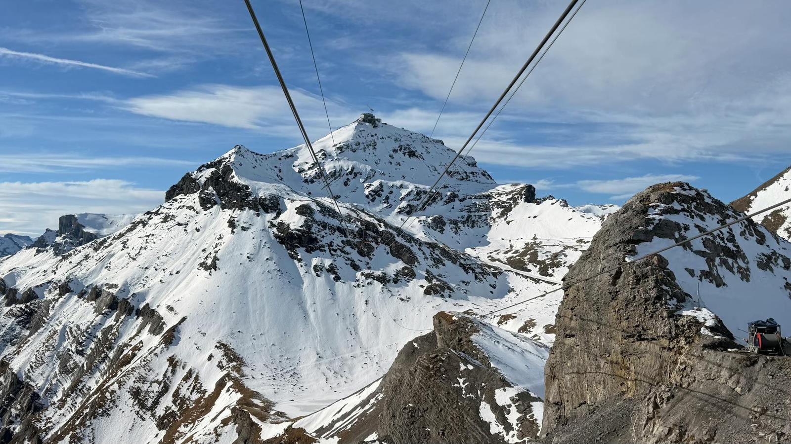 Captivating snowy peaks of the Swiss Alps in Lauterbrunnen with a cable car passing