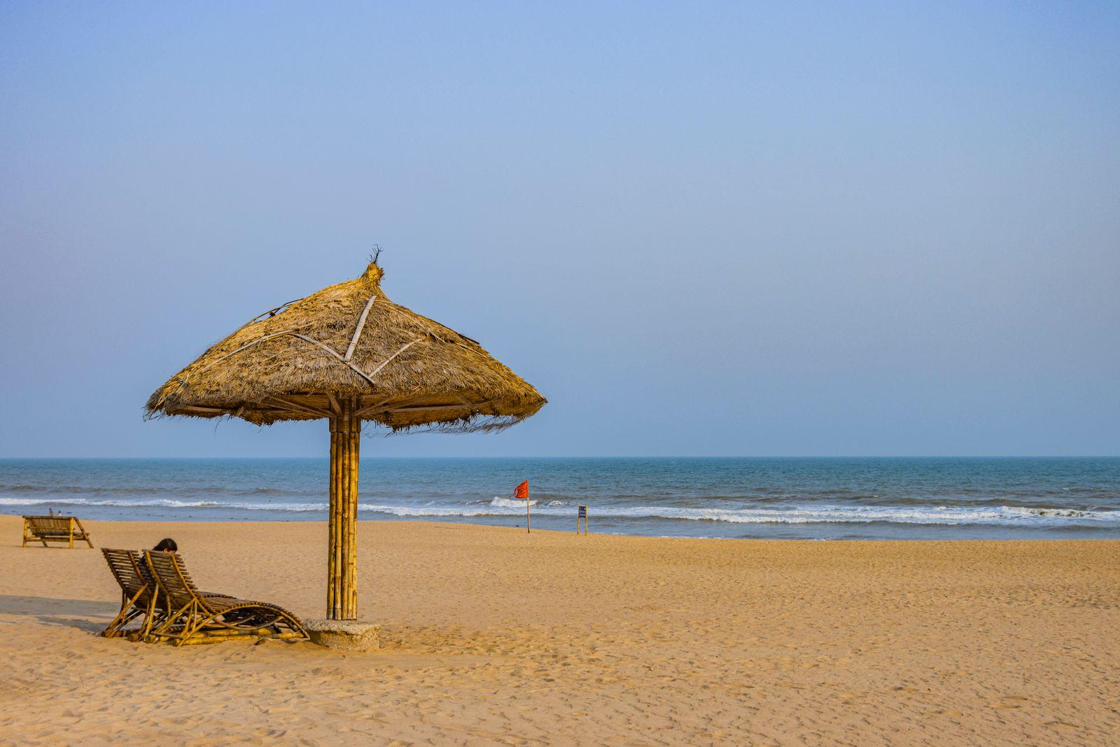 A thatched umbrella on the open sands of Puri beach
