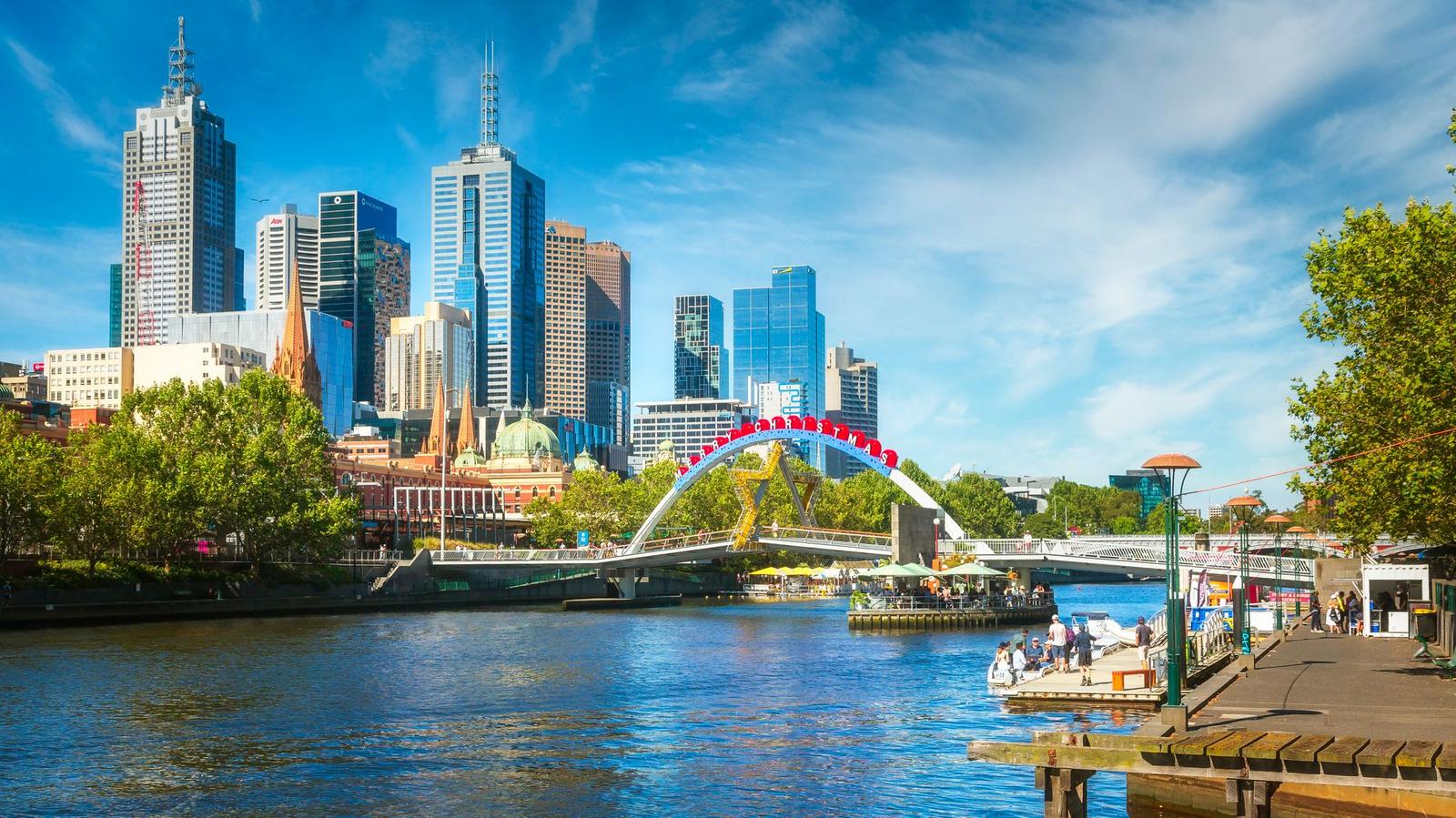 Vibrant skyline view of Melbourne, Australia with Yarra River in the foreground