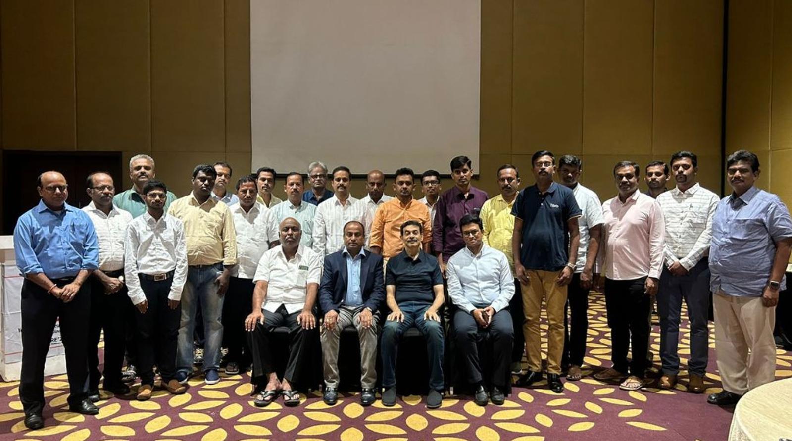 People posing together in hall