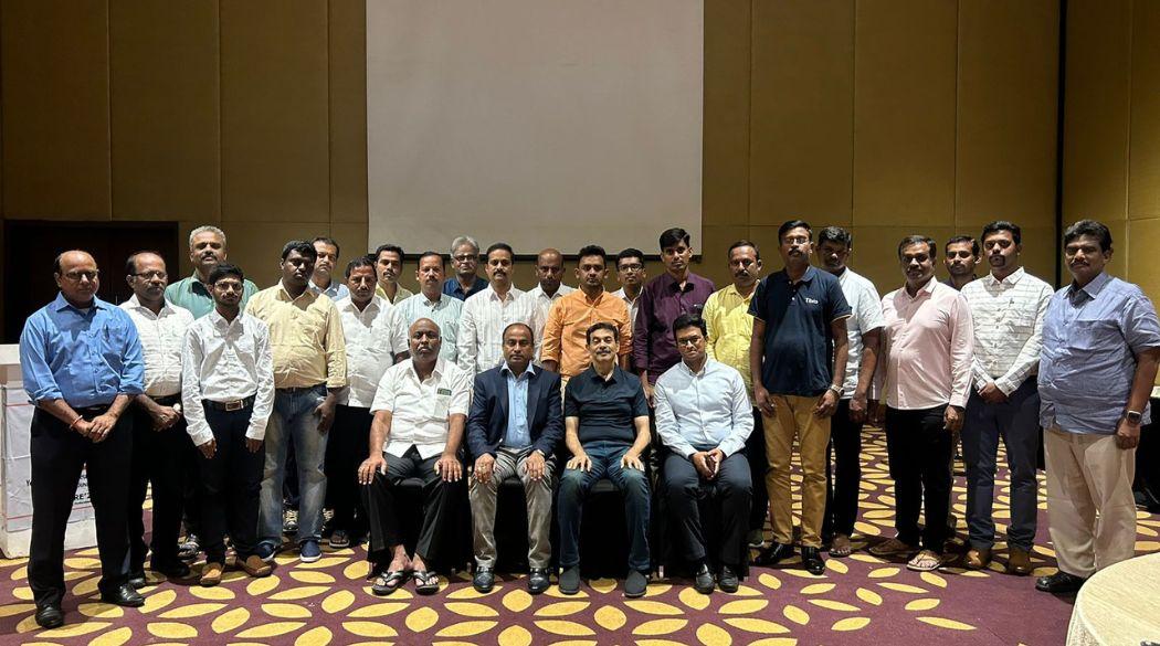 People posing together in hall