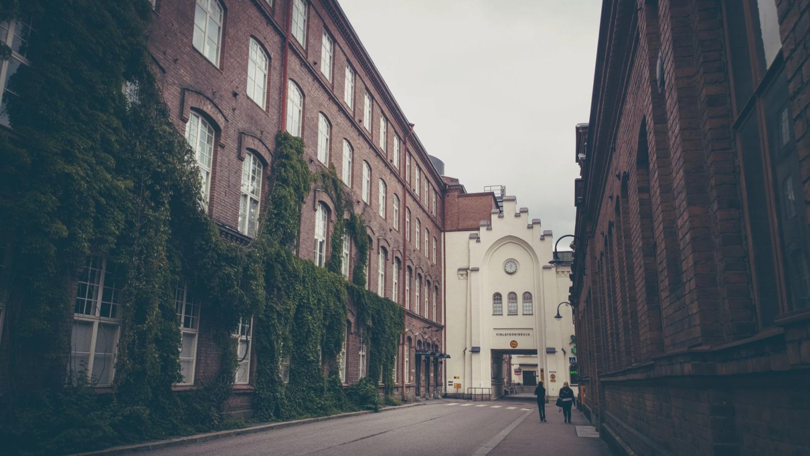A cozy street flanked by historic brick buildings in Tampere, Finland