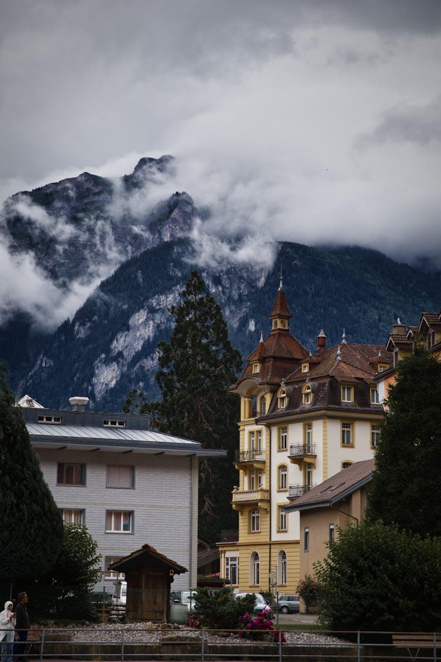 Picturesque view of Interlaken with cloud-covered Alps in Swiss summer scenery