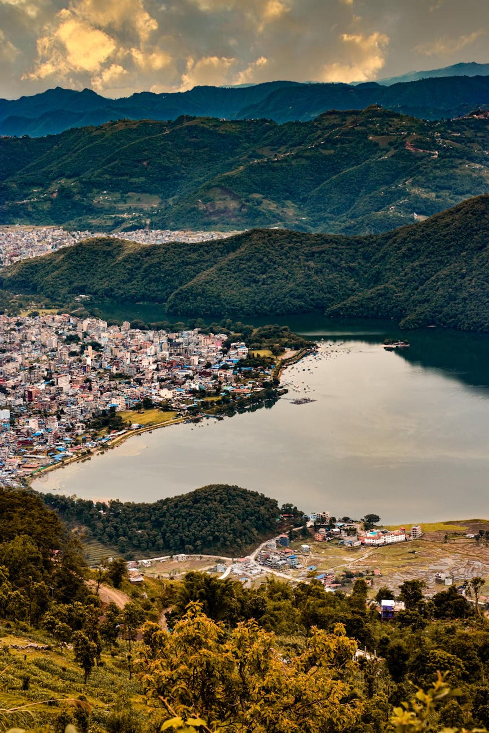 Stunning aerial view of Pokhara city nestled by the serene Phewa Lake in Nepal