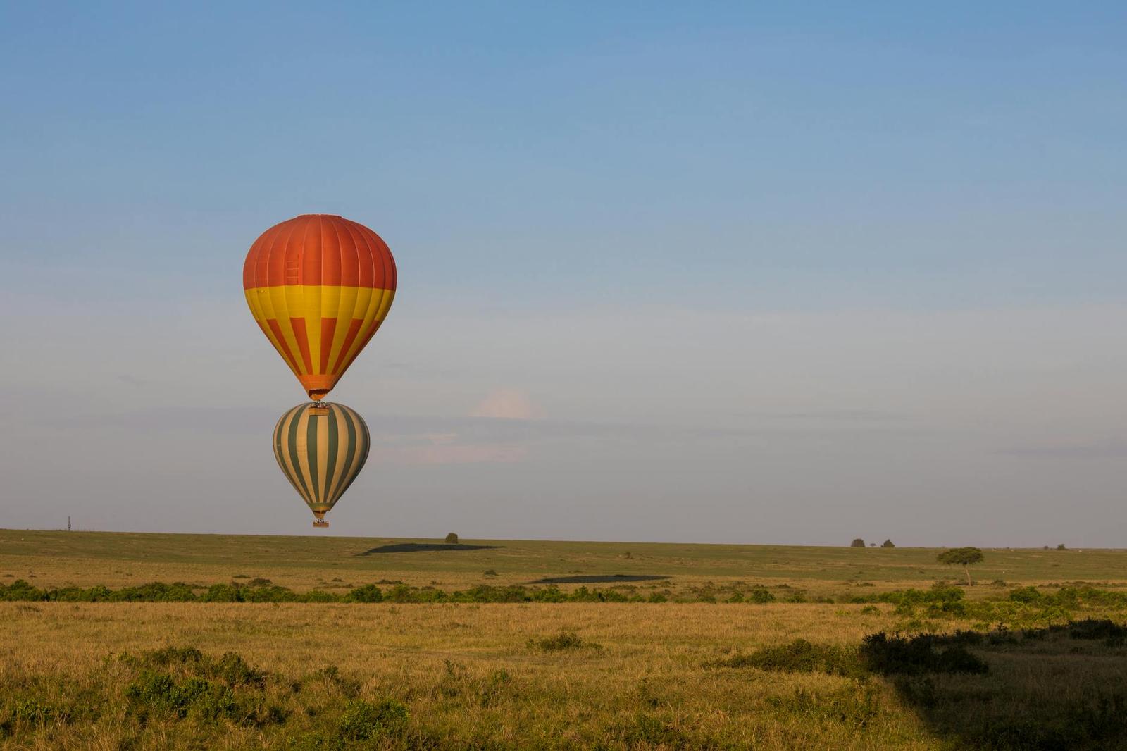 Hot-air balloon over the Maasai Mara plains at dawn