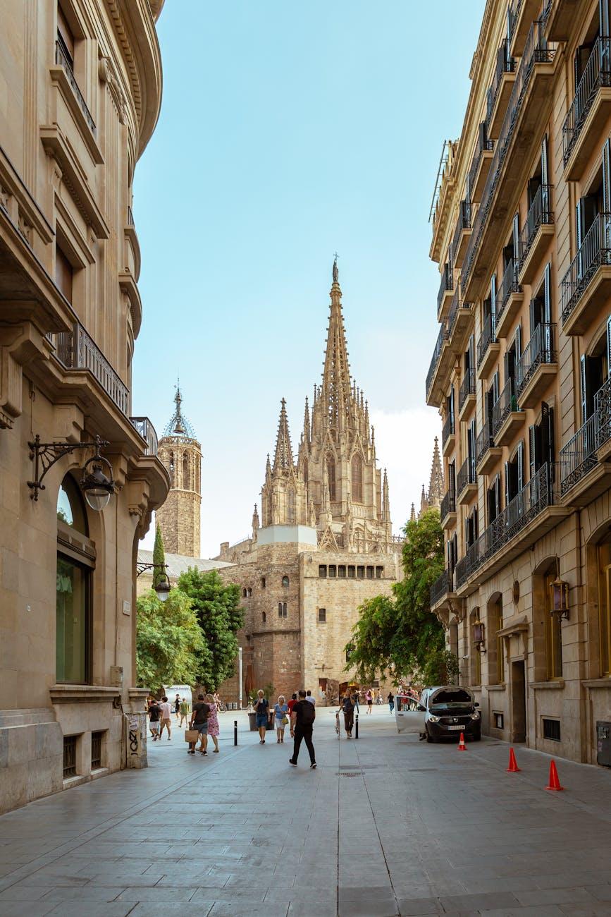 A vibrant street view showcasing the iconic Barcelona Cathedral's Gothic architecture