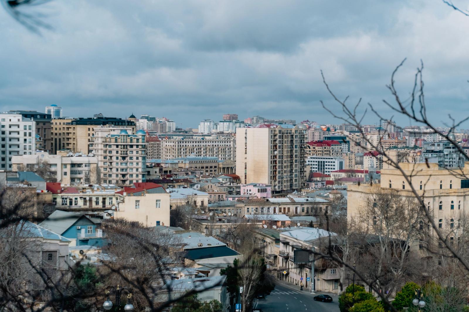 A beautiful view of Baku, Azerbaijan, showcasing its diverse architecture under a cloudy sky