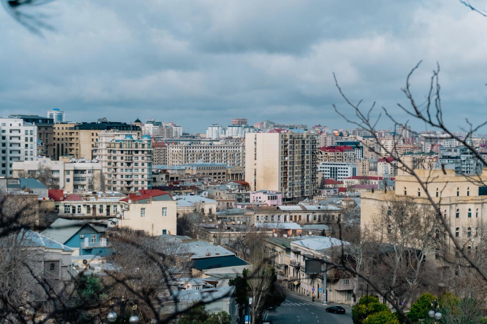 A beautiful view of Baku, Azerbaijan, showcasing its diverse architecture under a cloudy sky