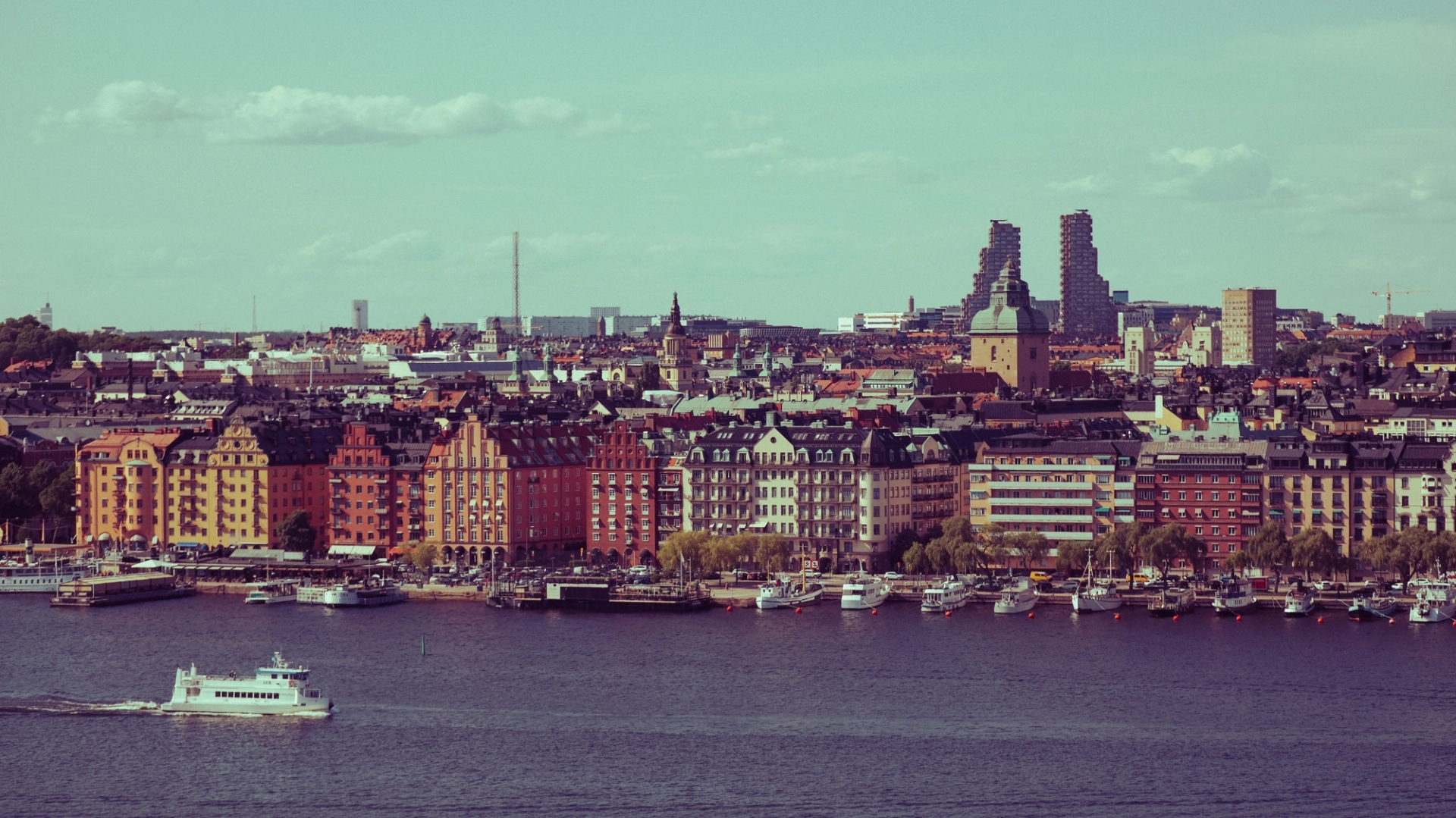 Vibrant cityscape of Stockholm, featuring historic and modern architecture by the water