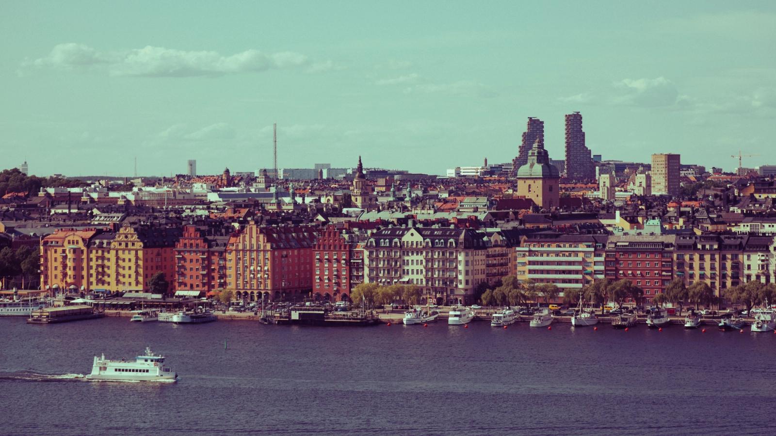 Vibrant cityscape of Stockholm, featuring historic and modern architecture by the water