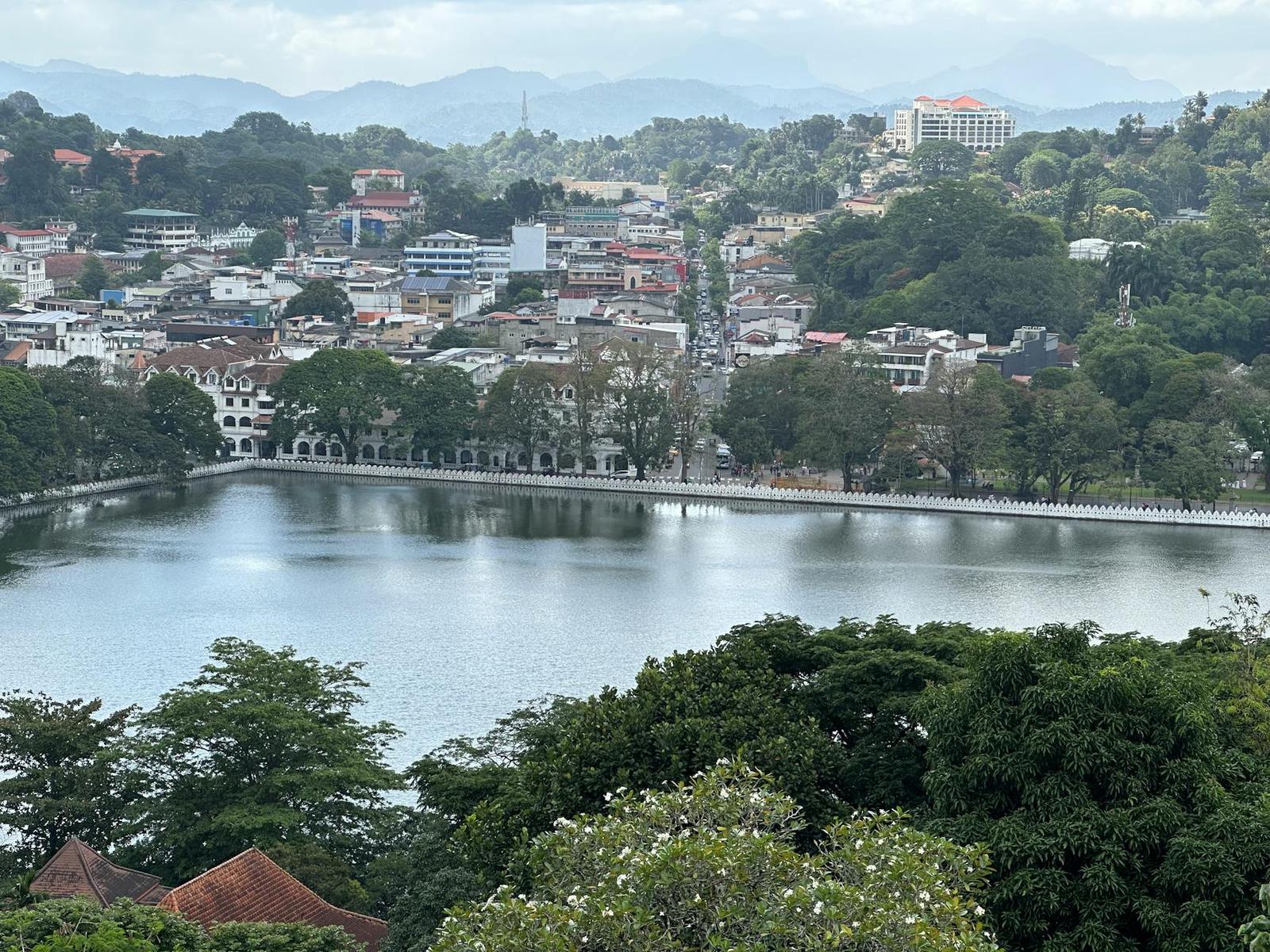 Aerial view of Kandy city with lush greenery and tranquil Kandy Lake in Sri Lanka