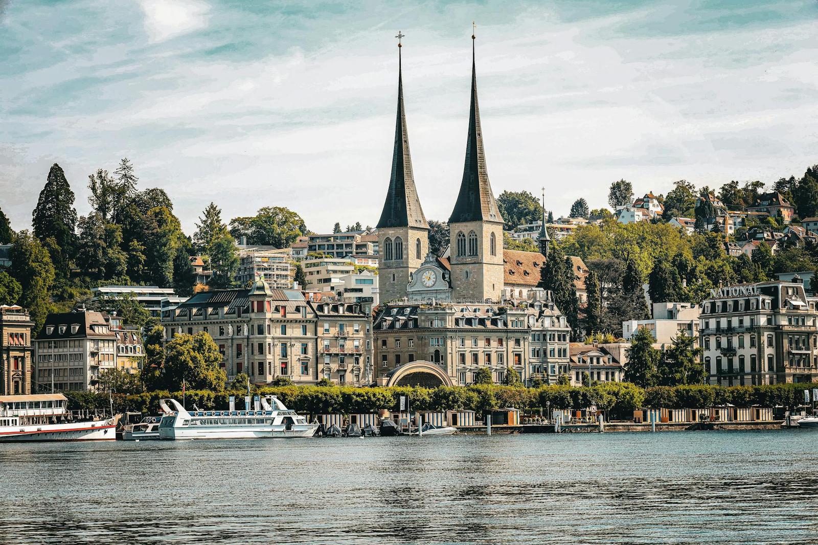 Captivating cityscape of Lucerne featuring the Church of St. Leodegar and Lake Lucerne