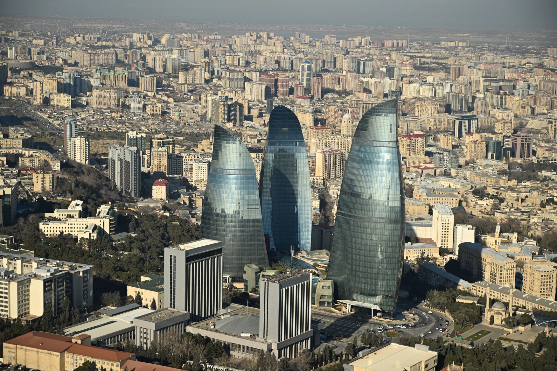Aerial view of modern architecture featuring the iconic Flame Towers in Baku, showcasing the city's urban landscape