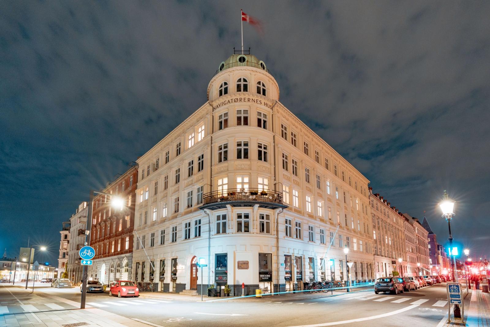 Captivating night view of the illuminated Navigatorernes Building in Copenhagen, Denmark