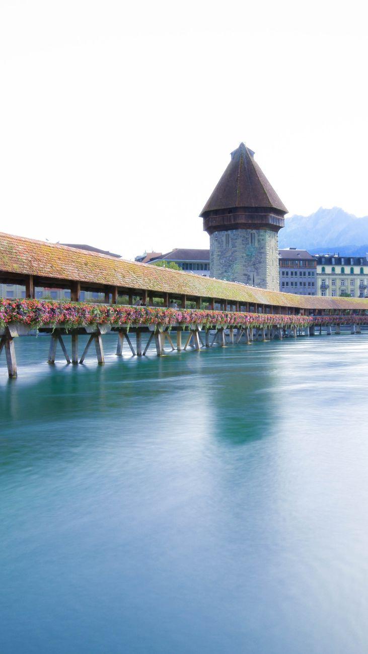 Scenic view of Chapel Bridge and Water Tower over the Reuss River in Lucerne, Switzerland